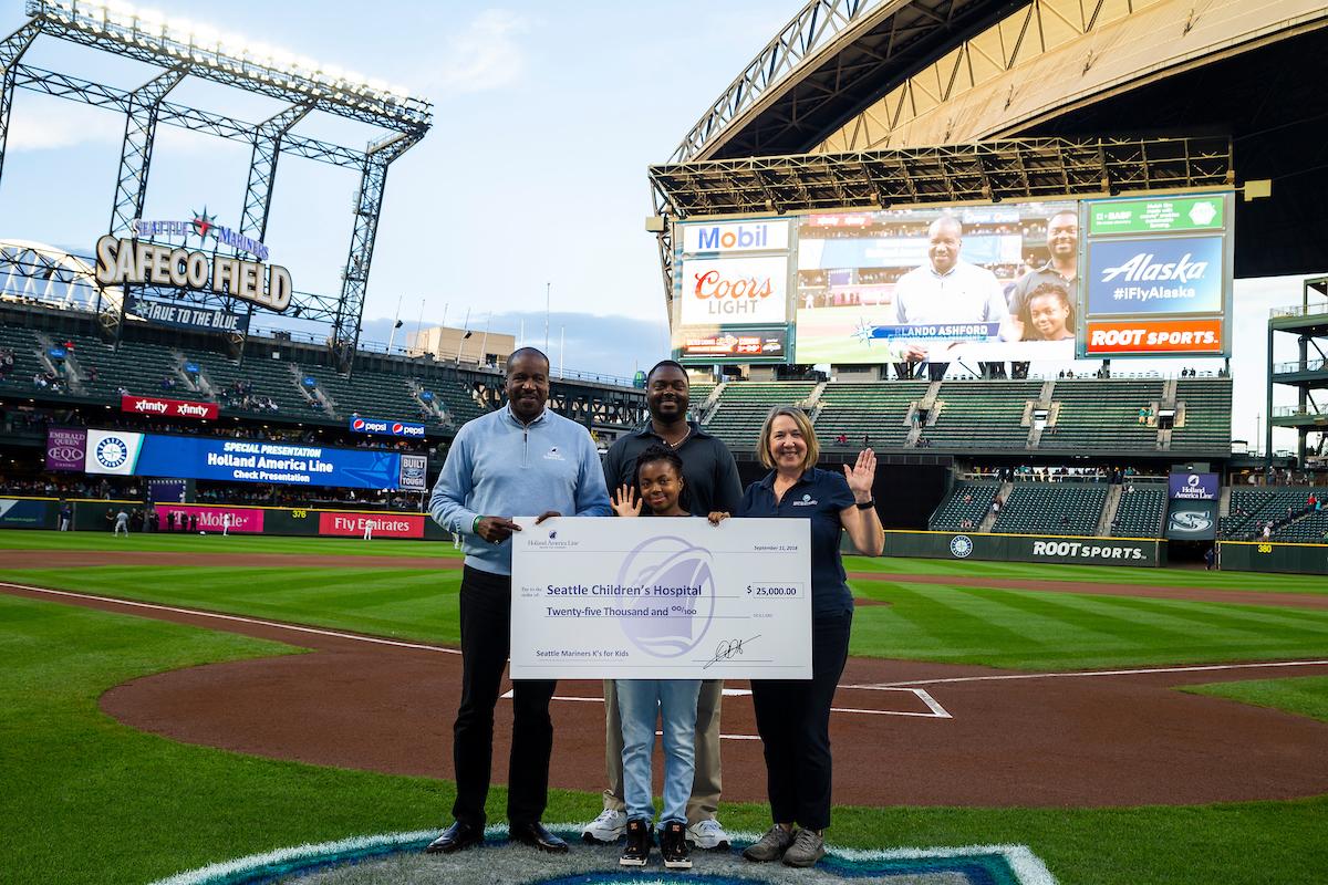 Holland America Line President Orlando Ashford presenting check to Seattle Children’s Uncompensated Care Fund on Sept. 11, 2018