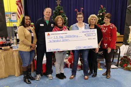 CITGO employees presenting the $600 donation to E.K. Elementary.